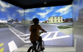 person on bike in simulator